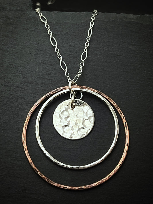 Sterling silver and copper forged hoop necklace with sterling silver disk