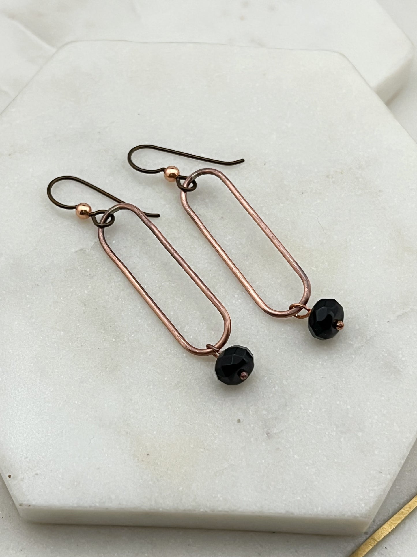 Copper oval hoops with onyx gemstones