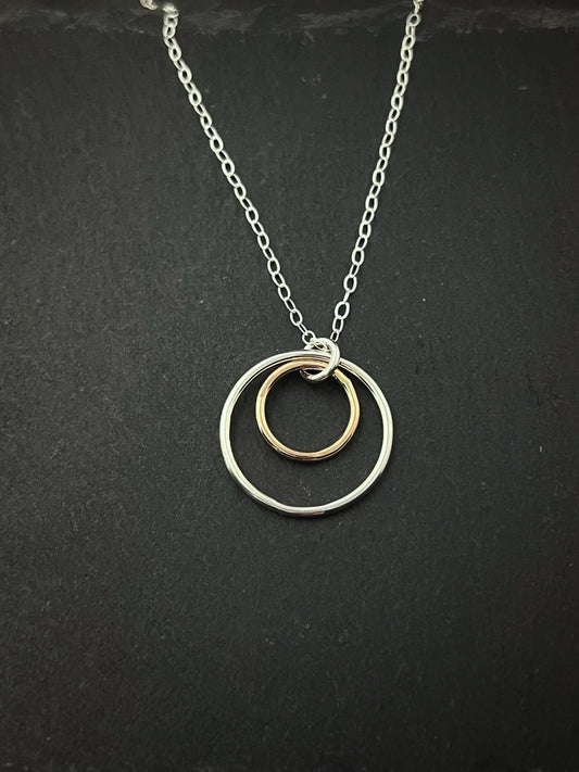 Forged sterling silver and 14 karat gold dainty double hoop necklace