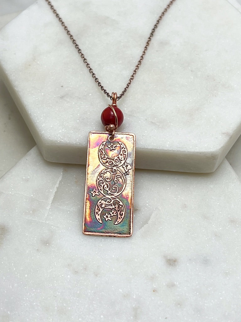 Copper moon necklace with coral gemstones