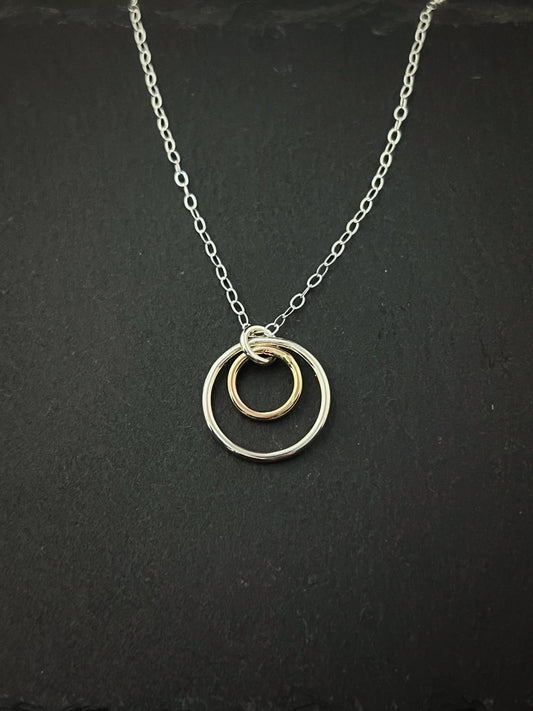 Forged sterling silver and 14 karat gold dainty double hoop necklace