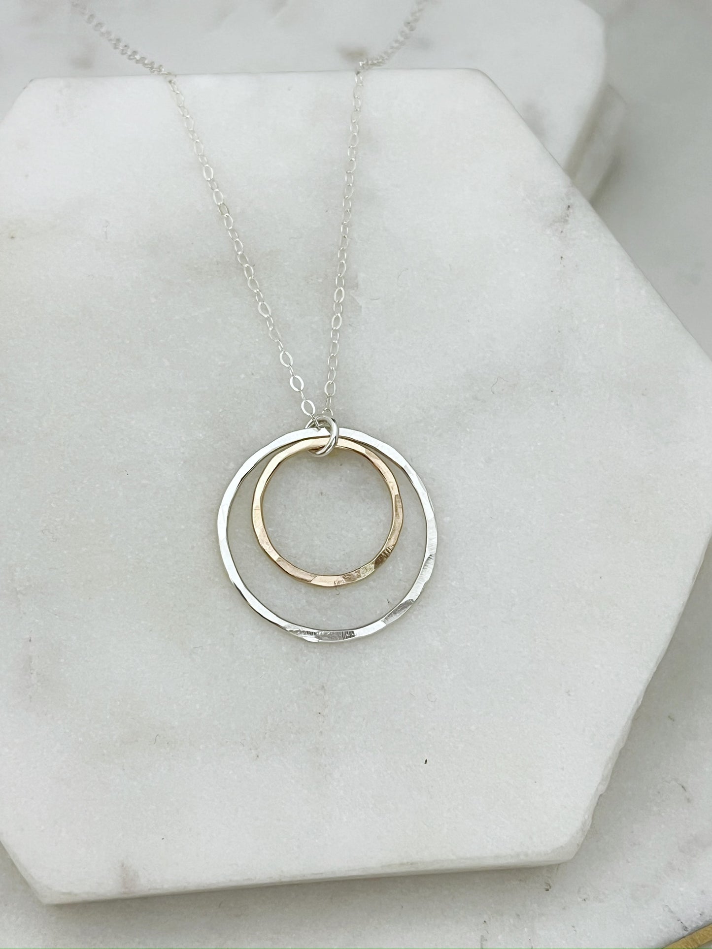 Sterling silver and 14 karat gold forged double hoop necklace