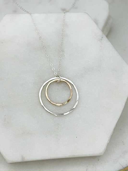 Sterling silver and 14 karat gold forged double hoop necklace