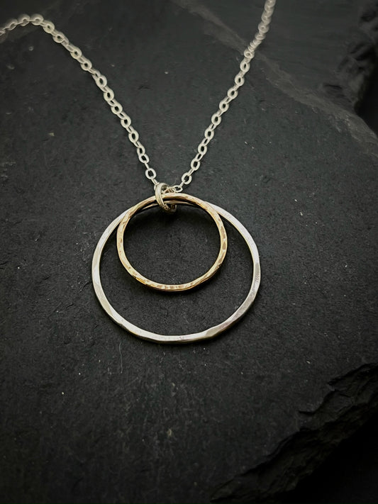 Forged sterling silver and 14 karat gold double hoop necklace