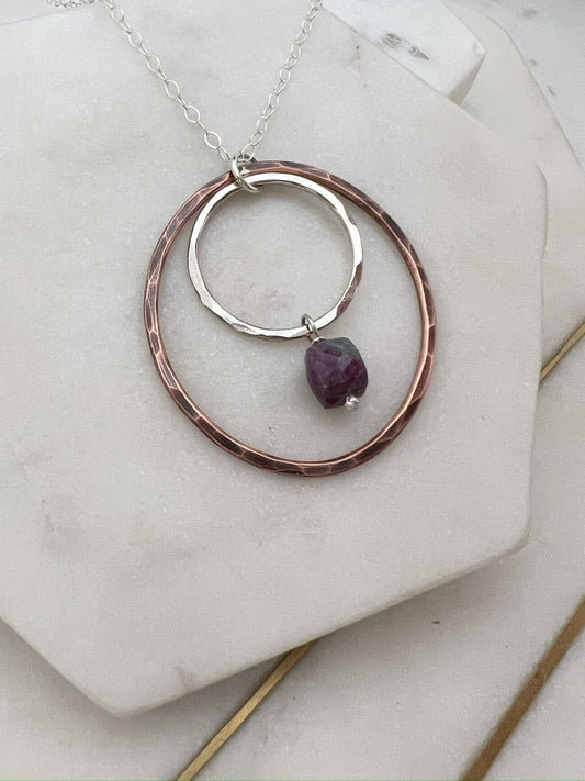 Sterling silver and copper forged hoop necklace with ruby zosite