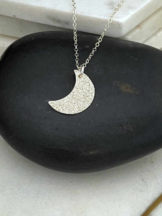 Forged and textured sterling silver moon necklace