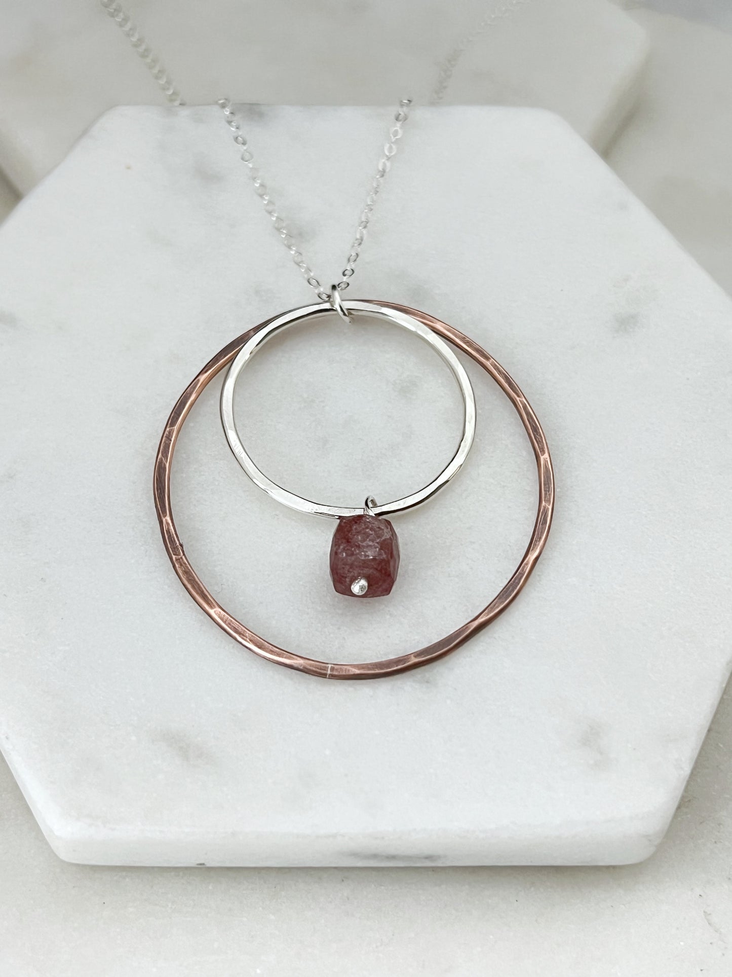 Sterling silver and copper forged hoop necklace with strawberry quartz
