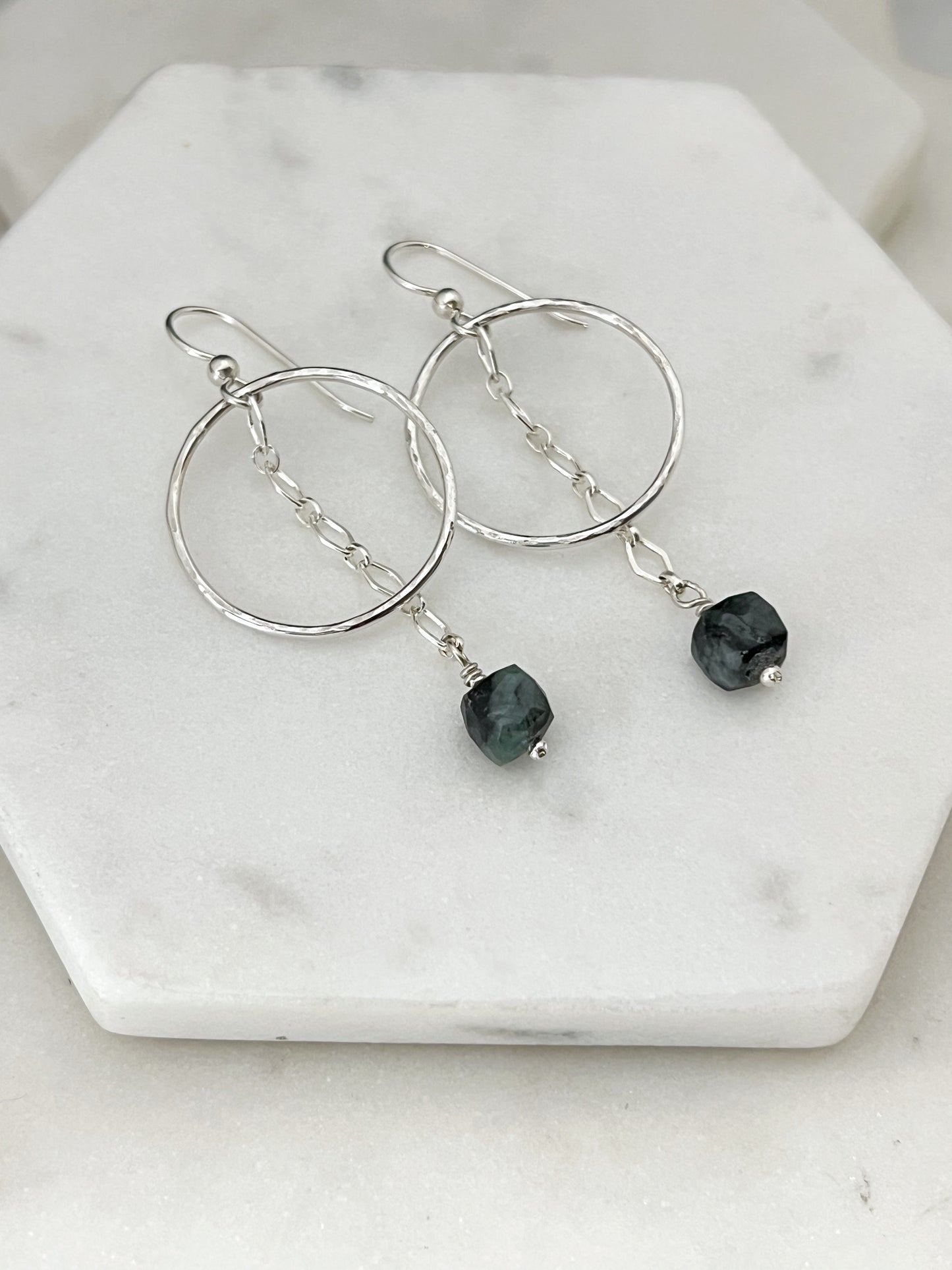 Sterling silver hoops with emerald