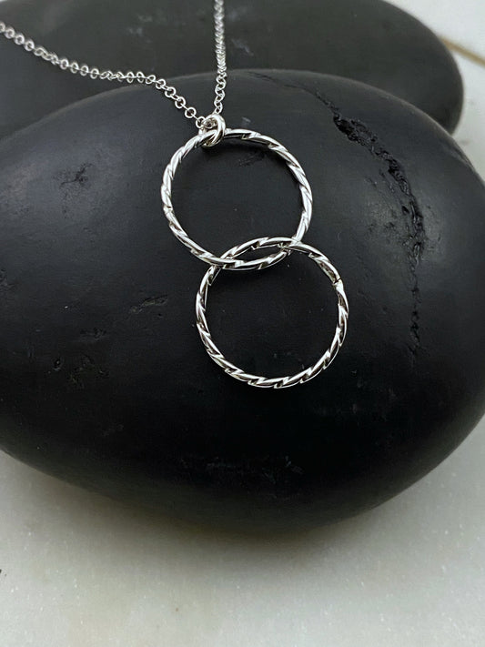Sterling silver twisted and forged double hoop necklace