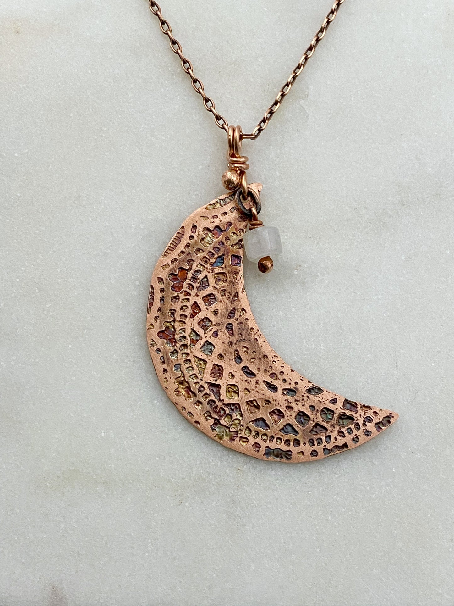 Crescent moon acid etched copper necklace with a moonstone gemstone