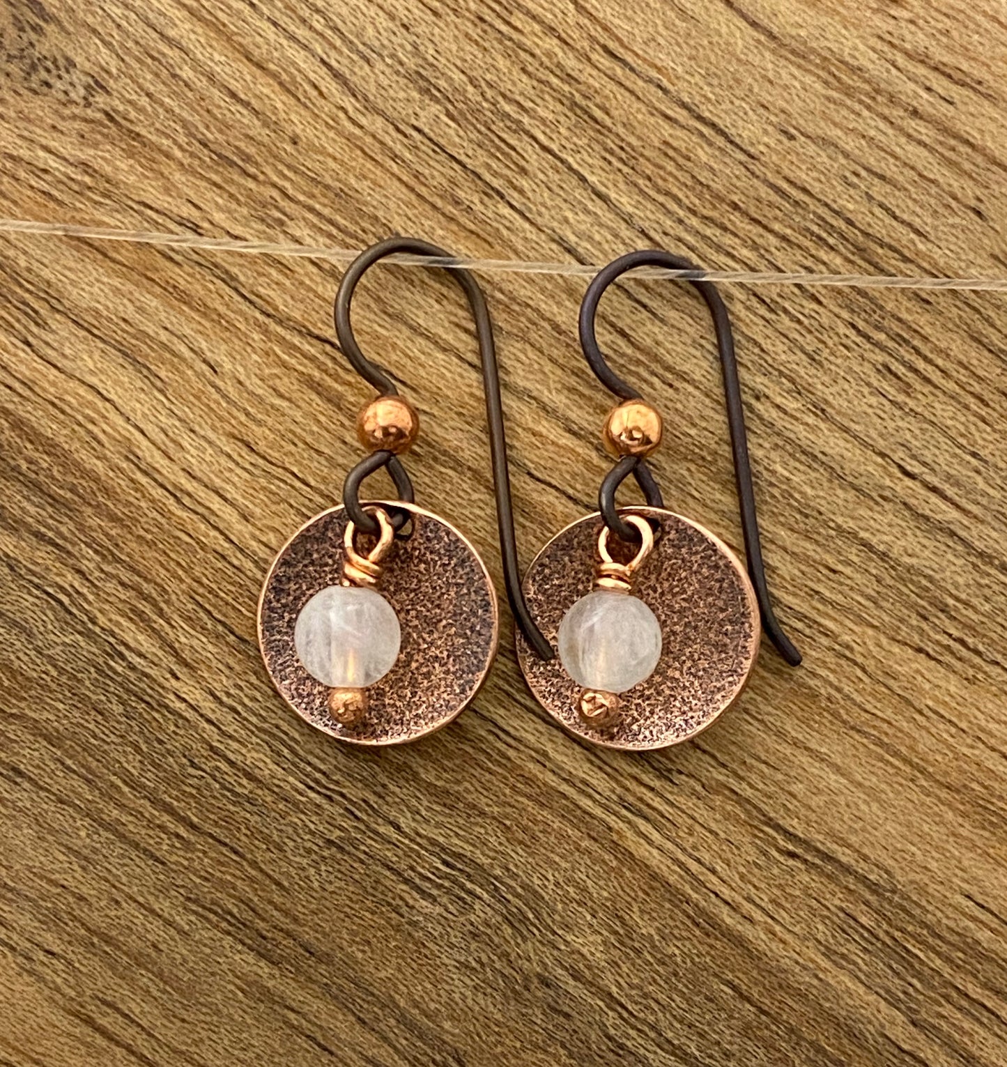Forged copper teardrop earrings with moonstone