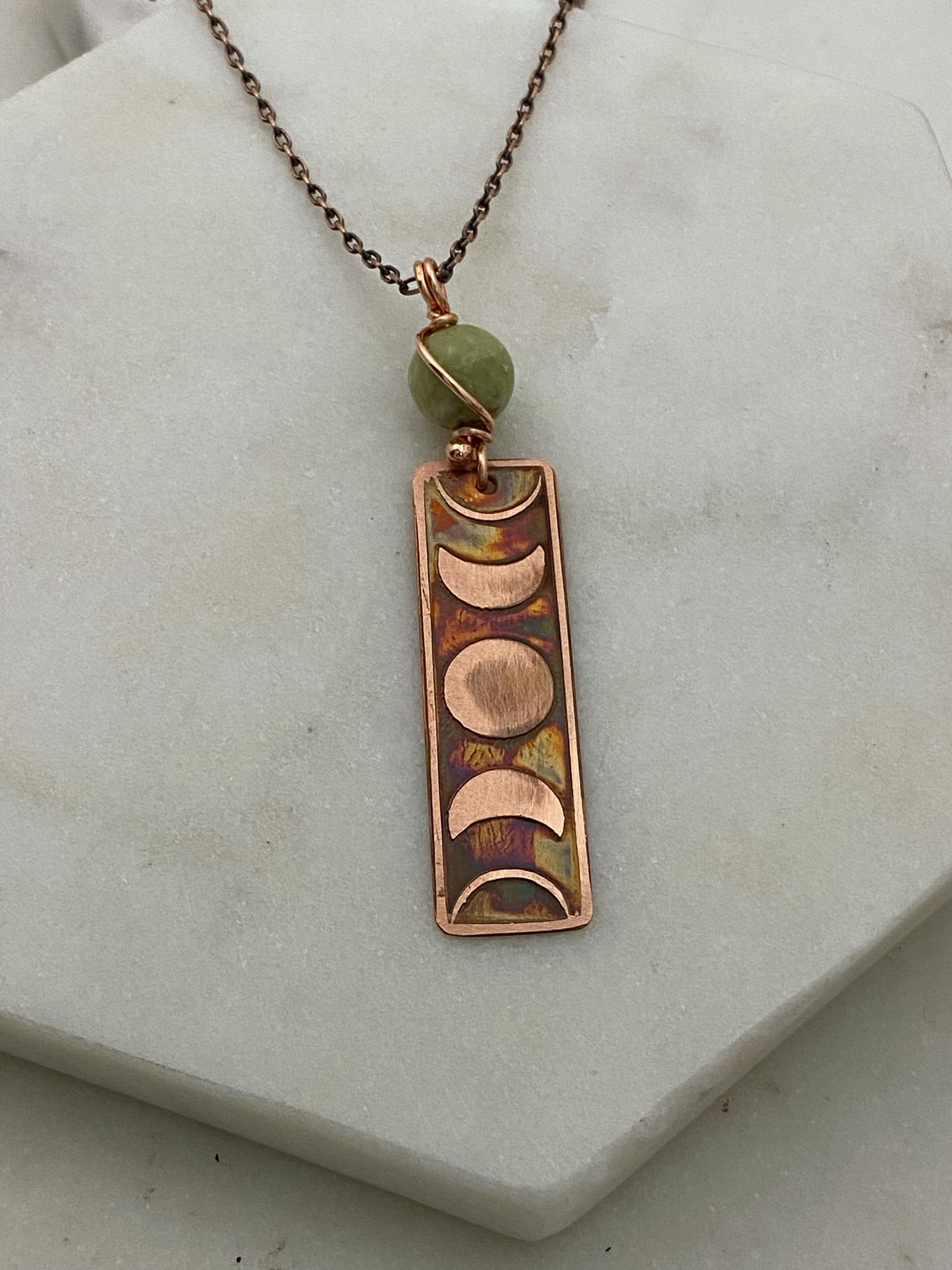 Moon phase acid etched copper necklace with green garnet gemstone