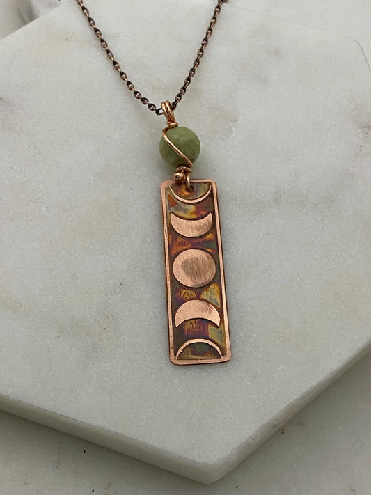 Moon phase acid etched copper necklace with green garnet gemstone