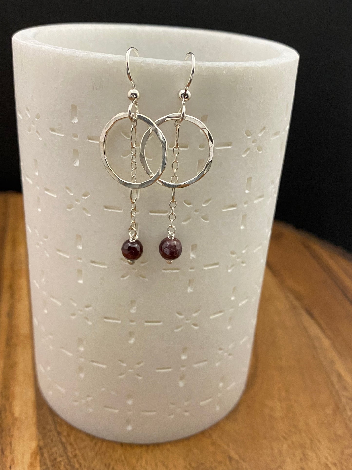 Sterling silver forged hoop earrings with garnet gemstone