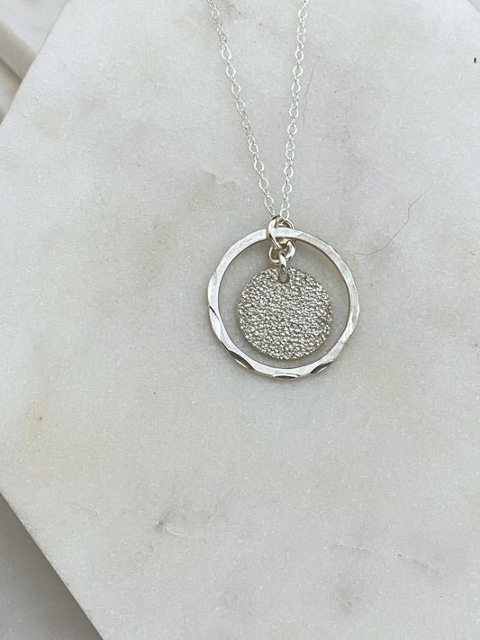 Sterling silver forged hoop with sterling disk