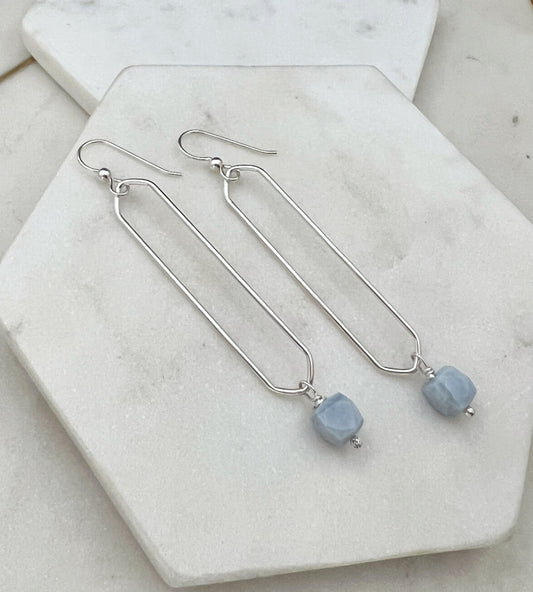Sterling silver oval hoops with blue opal