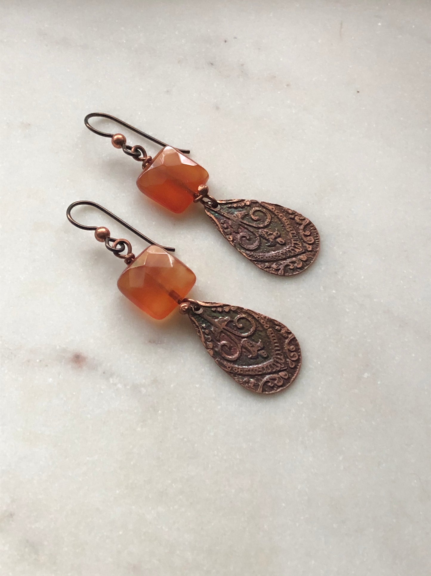 Acid etched copper teardrop earrings with carnelian gemstone.