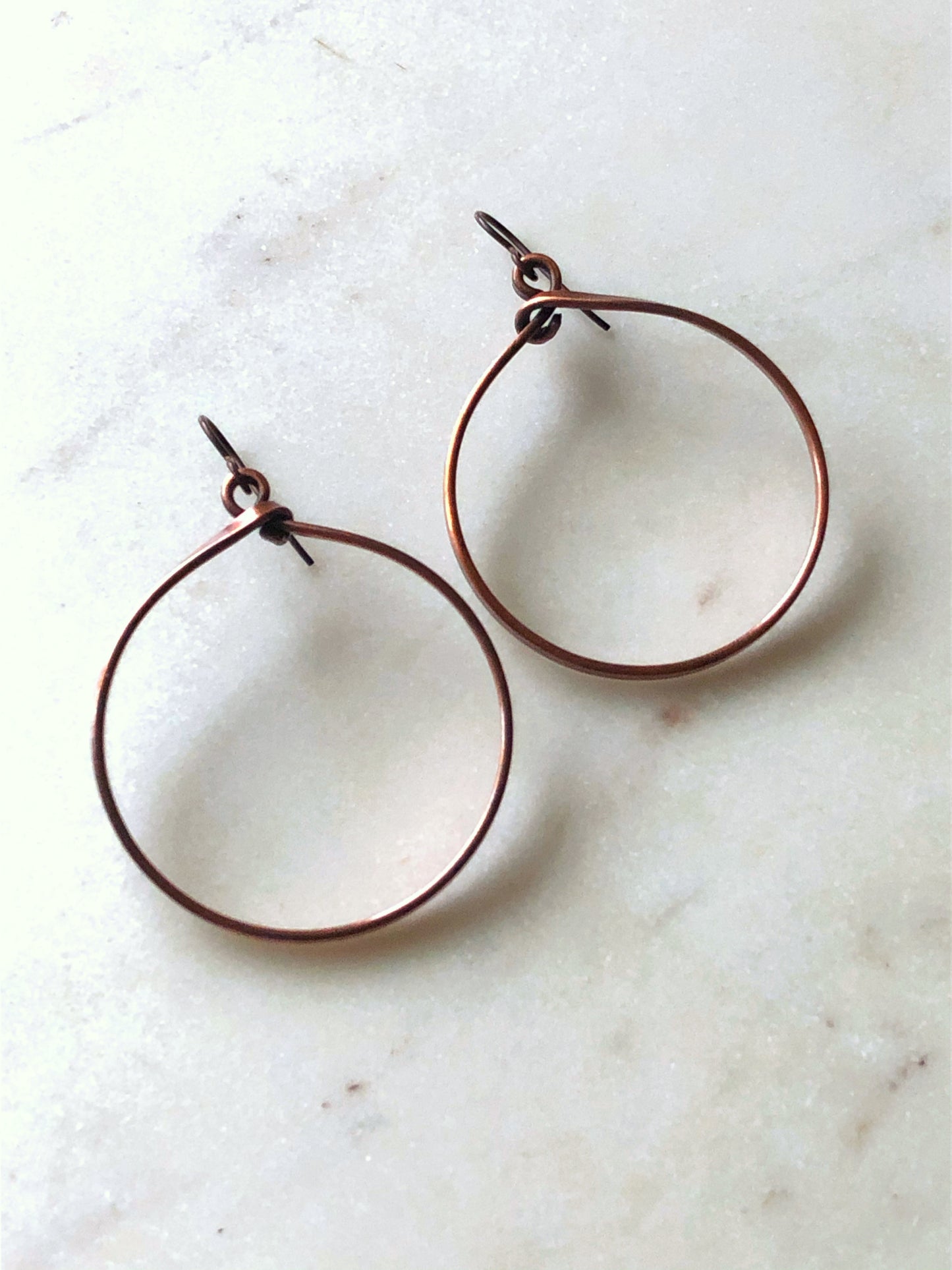 Large copper hoop earrings