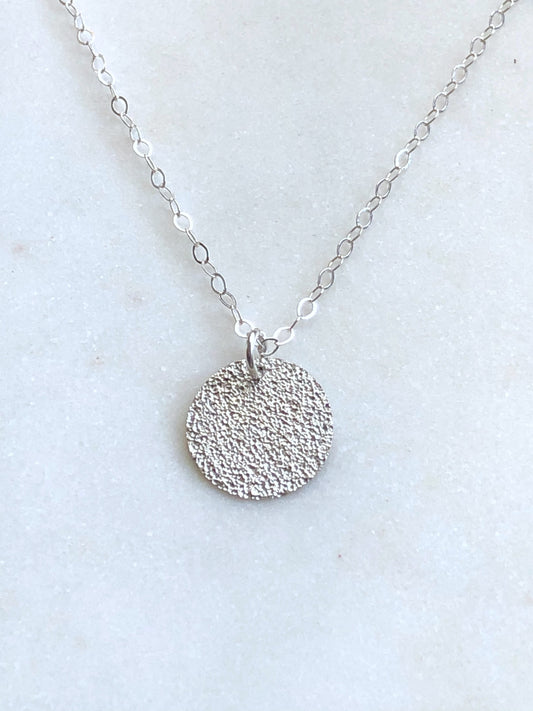 Sterling silver forged circle necklace