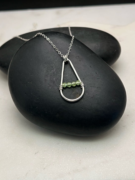Forged sterling silver necklace with peridot gemstones