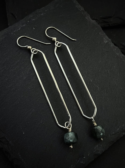 Sterling silver oval hoops with emerald gemstones