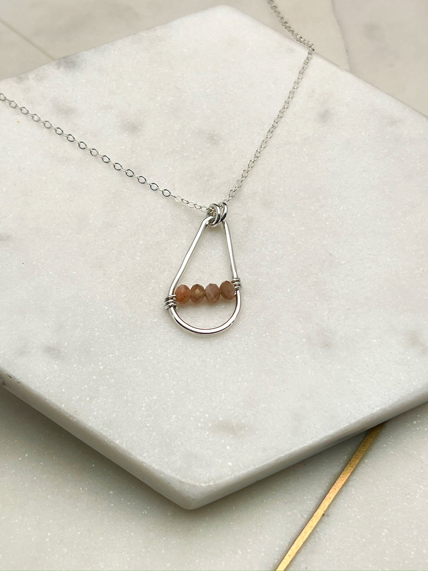 Forged sterling silver necklace with peach moonstone