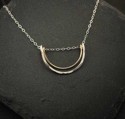 Forged sterling silver and 14 karat gold wire half moon necklace