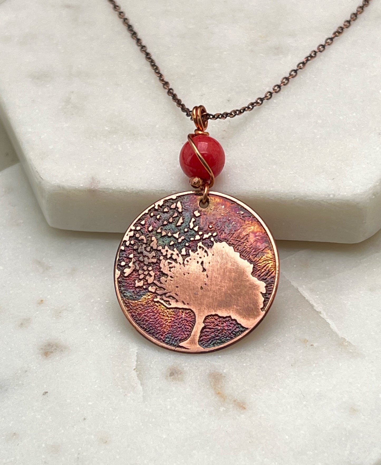 Acid etched copper tree necklace with coral gemstone