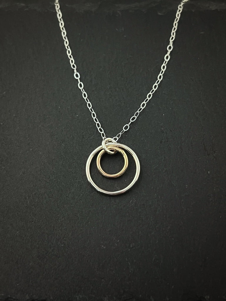 Forged sterling silver and 14 karat gold dainty double hoop necklace