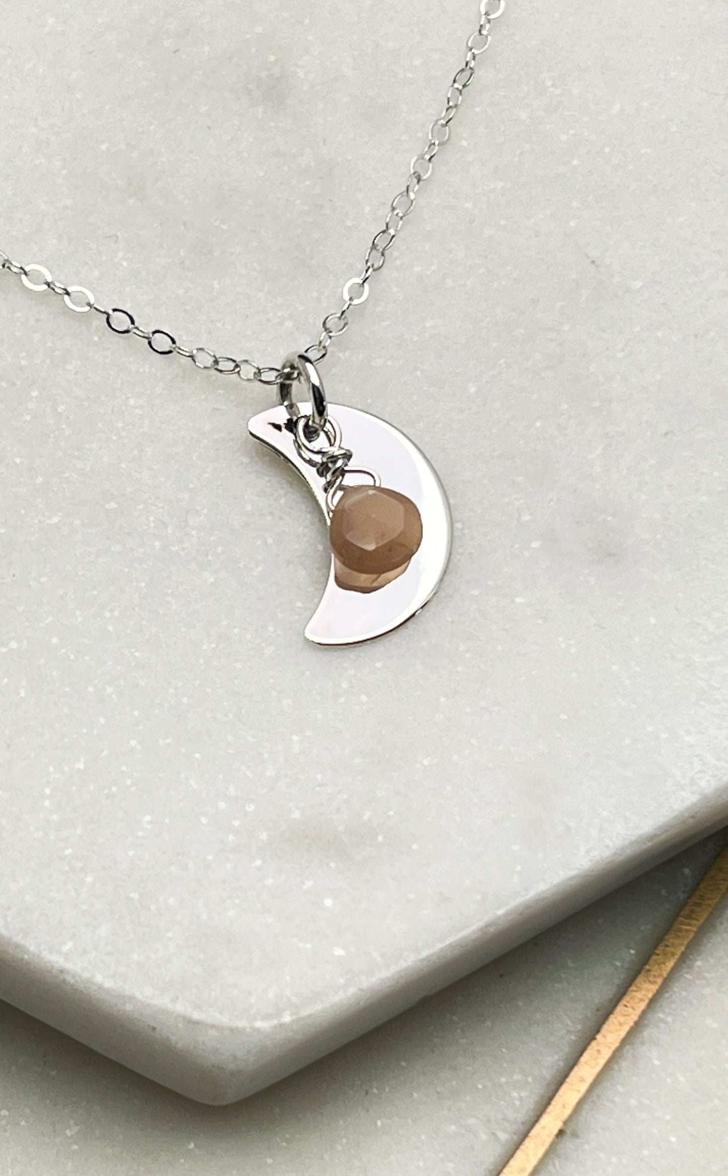 Forged sterling silver moon necklace with peach moonstone