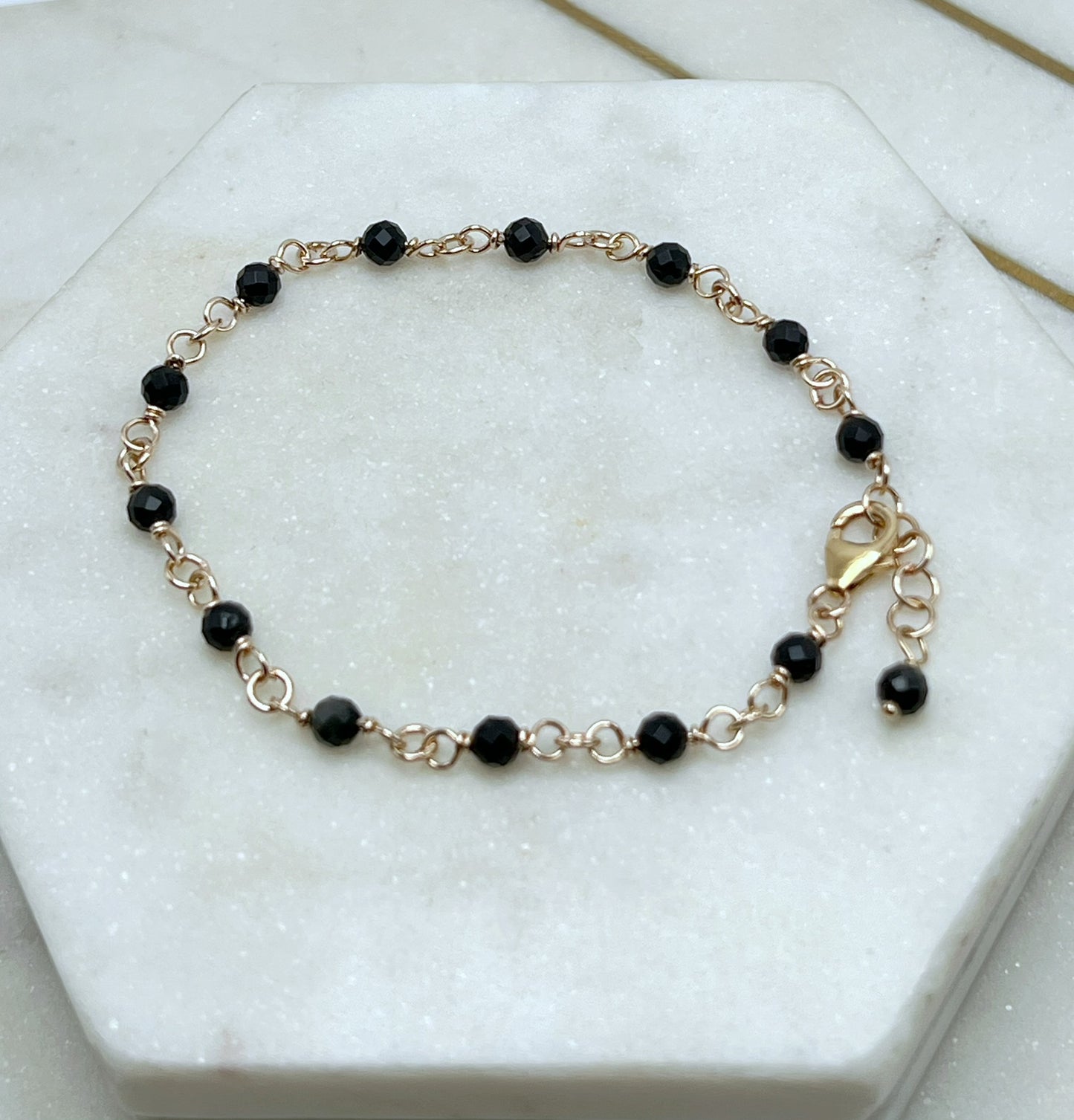 14K gold and faceted onyx bracelet