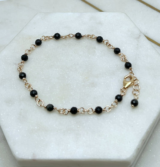 14K gold and faceted onyx bracelet
