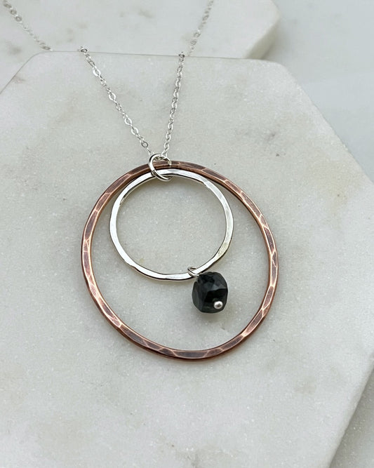 Sterling silver and copper forged hoop necklace with emerald