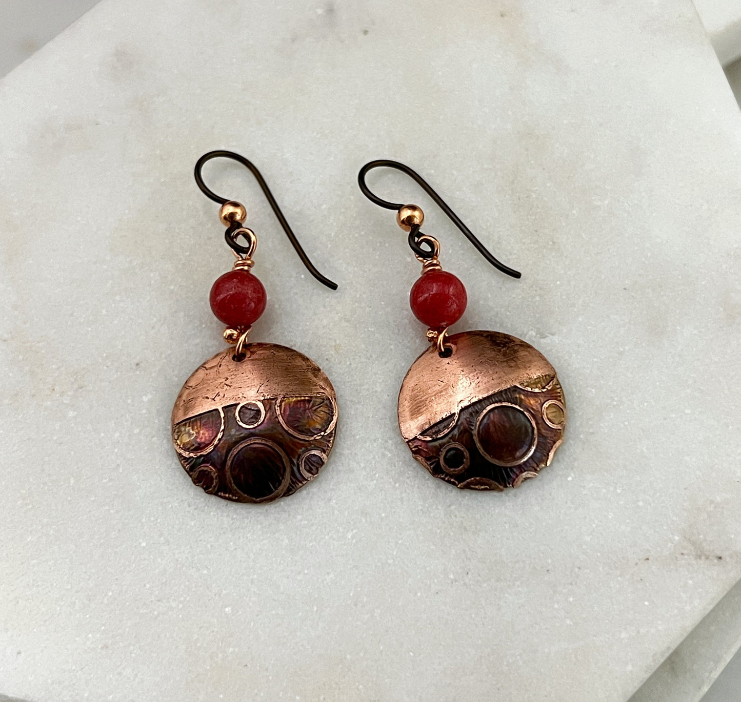 Acid etched copper earrings with coral gemstones