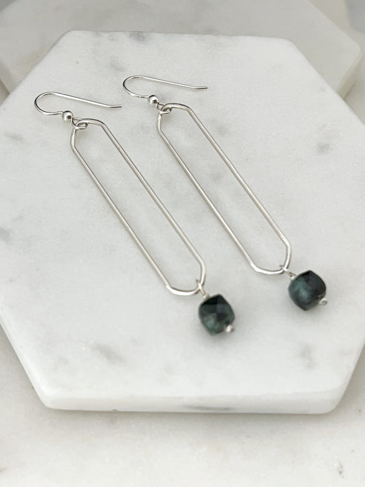 Sterling silver oval hoops with emerald