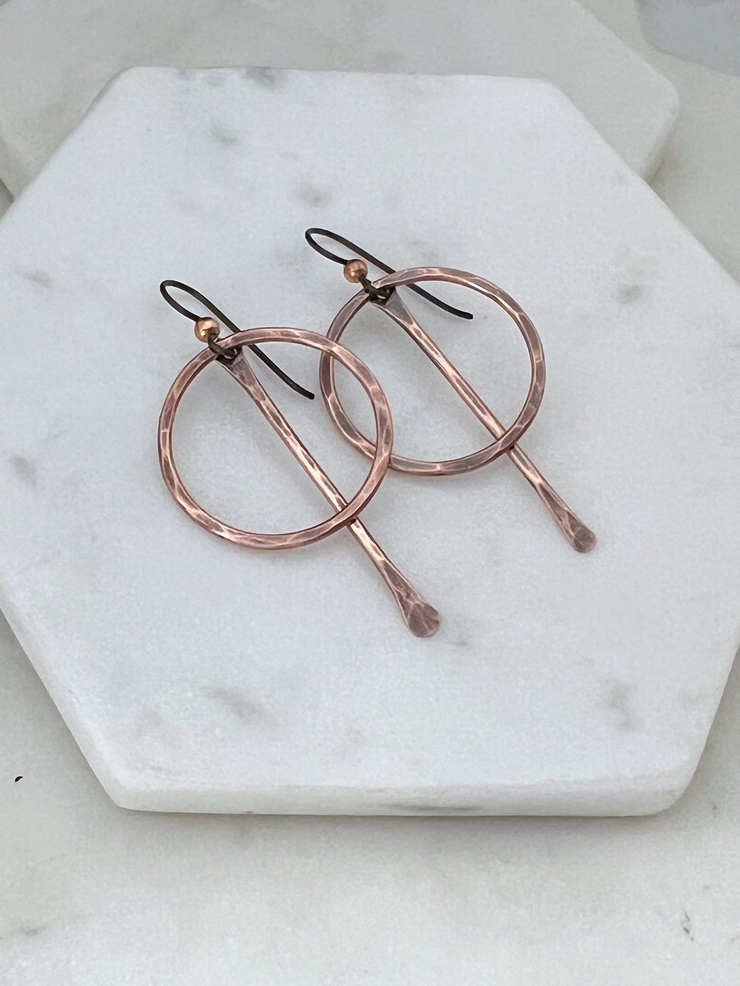 Forged Copper hoop earrings with paddle center