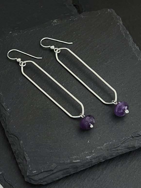 Sterling silver oval hoops with amethyst gemstones