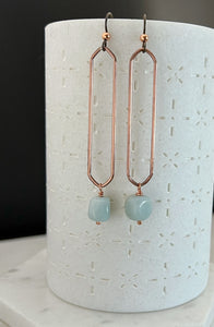 Copper oval hoops with fire agate gemstones