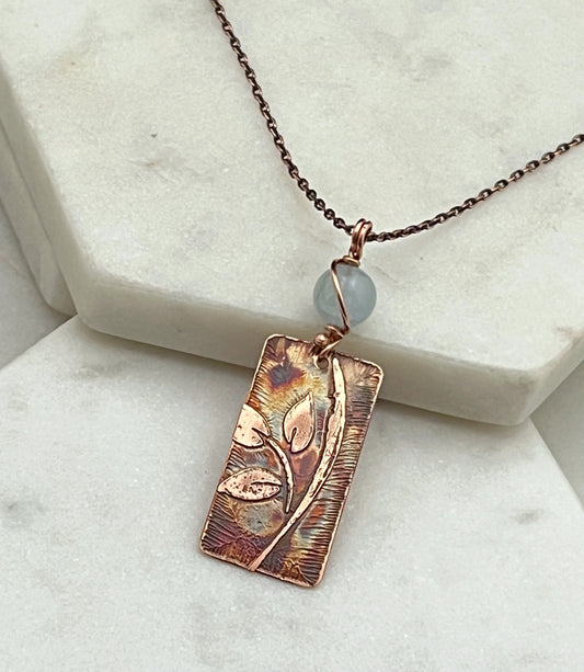 Acid etched copper leaf necklace with aquamarine gemstone