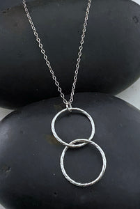 Sterling silver twisted and forged double hoop necklace