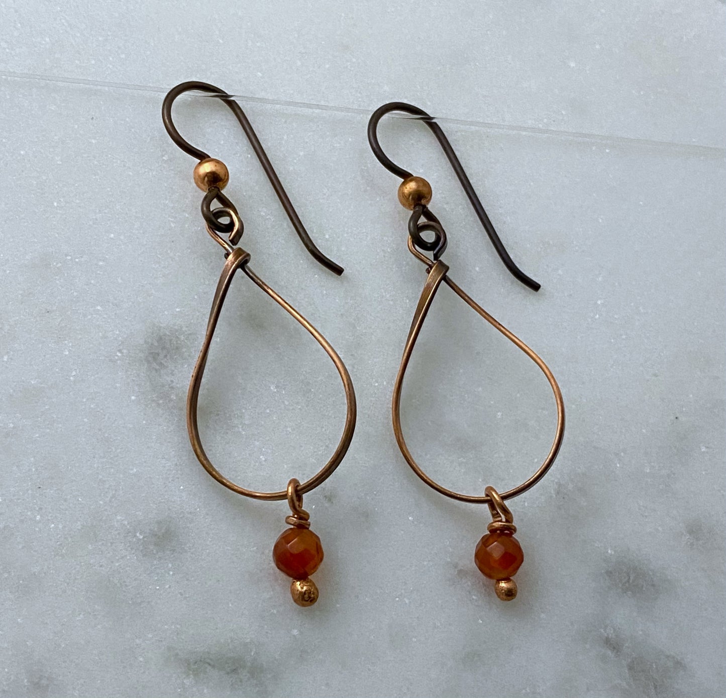 Copper teardrop earrings with carnelian