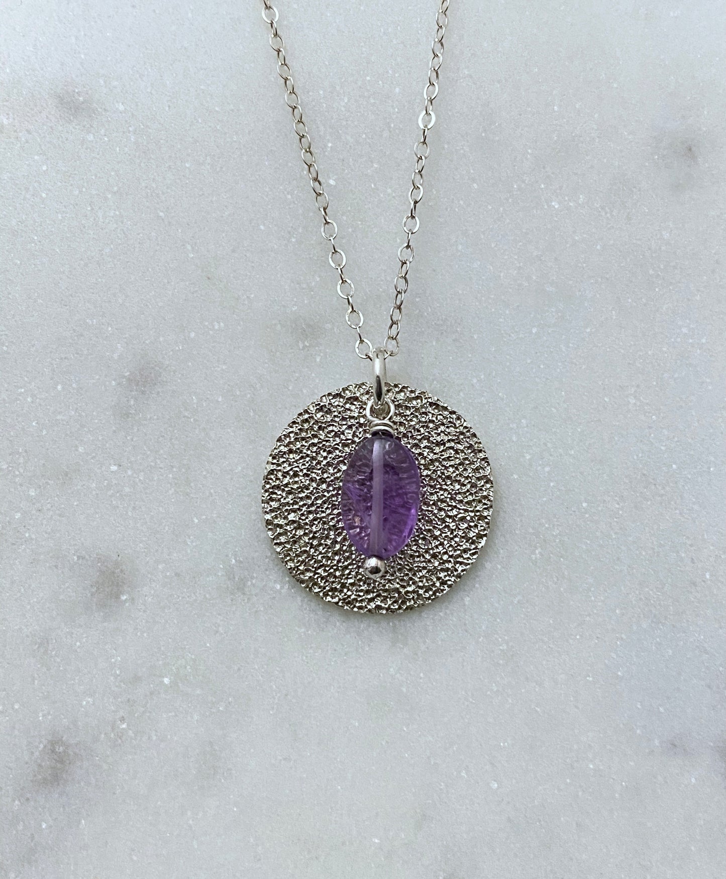 Sterling silver hammer textured necklace with amethyst gemstone