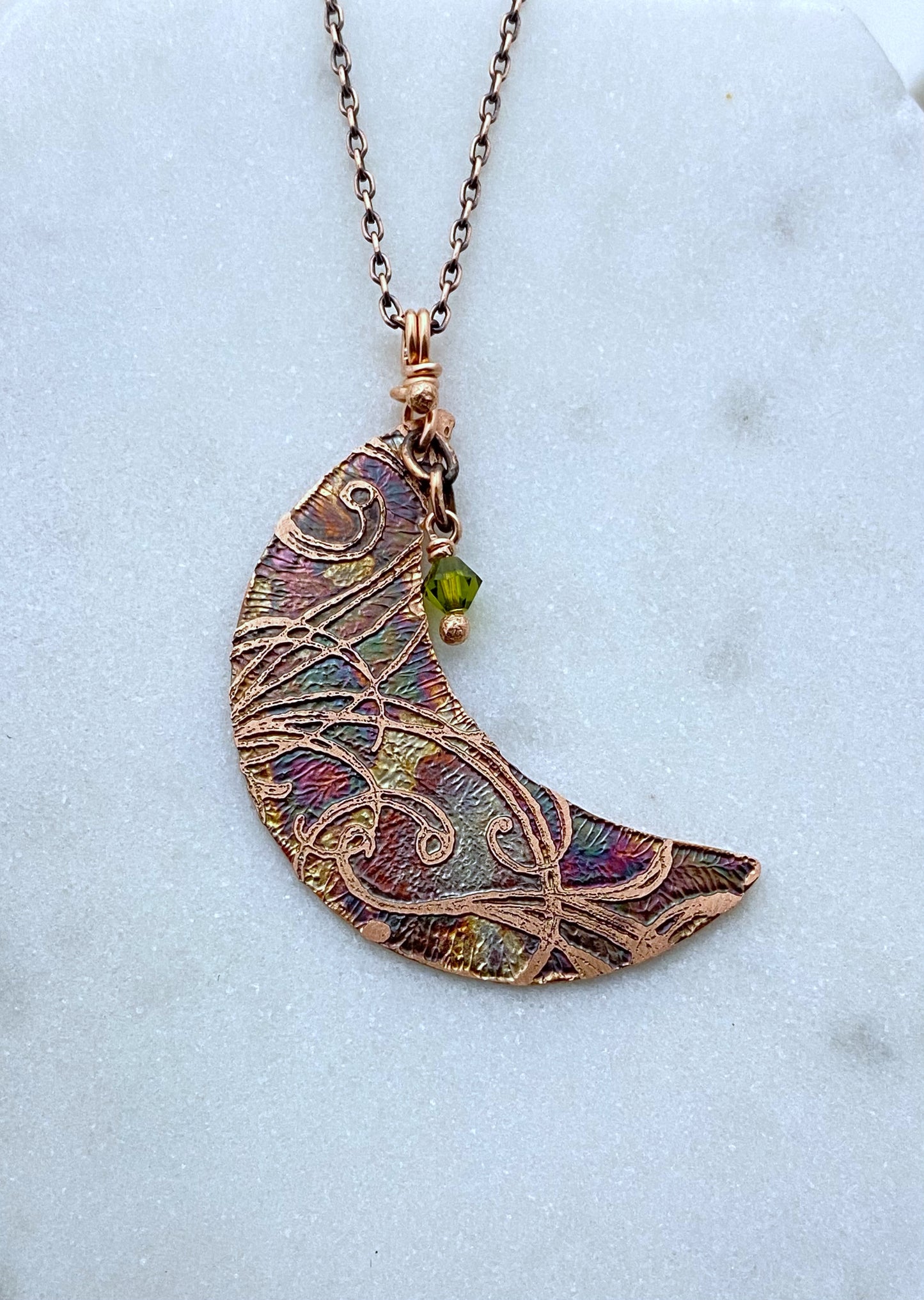 Crescent moon acid etched copper necklace with a olivine gemstone