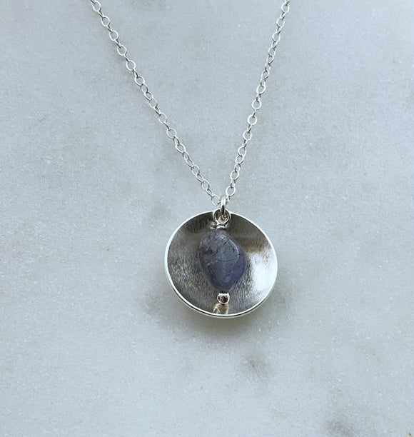 Sterling silver forged disk necklace with tanzanite