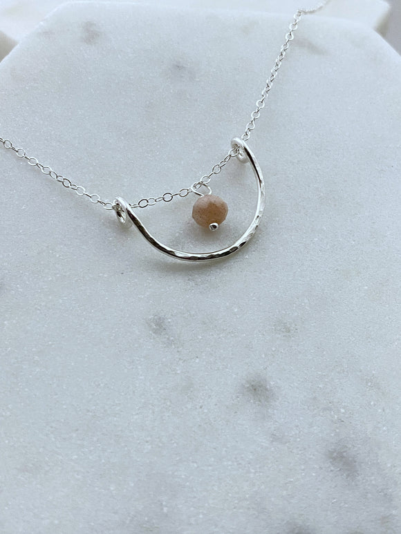 Forged sterling silver wire half moon necklace with peach moonstone