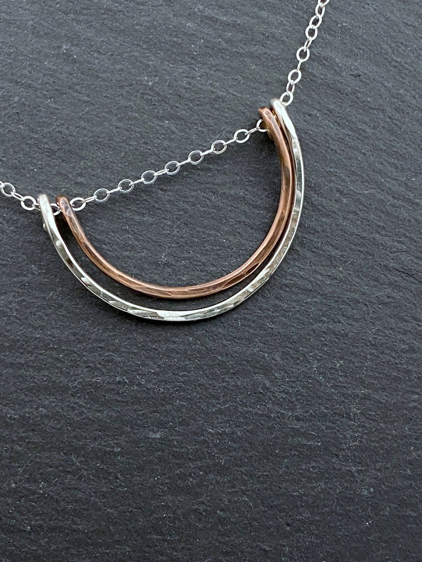 Forged sterling silver and copper wire half moon necklace