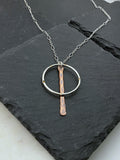 Sterling silver forged hoop necklace with copper paddle
