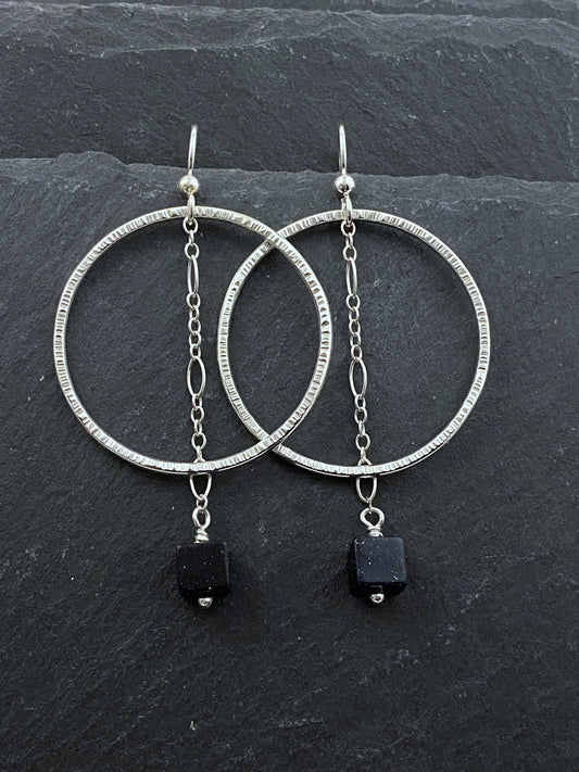 Sterling silver forged hoop earrings with blue goldstone