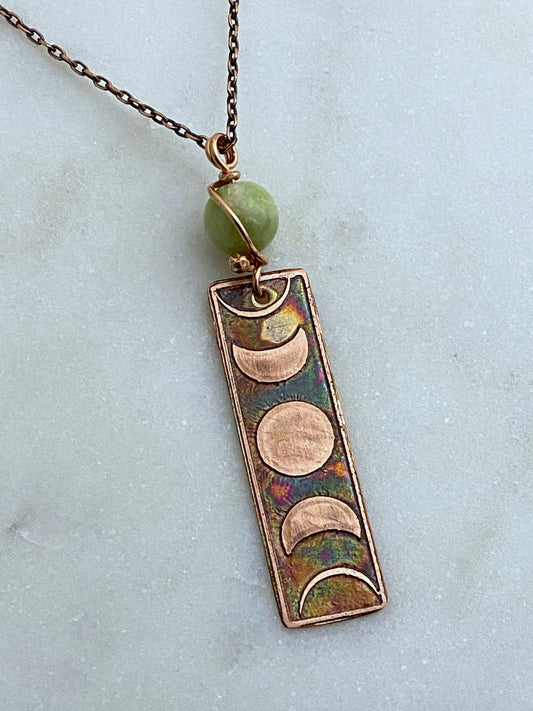 Moon phase acid etched copper necklace with green garnet gemstone