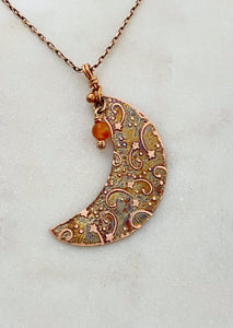 Crescent moon acid etched copper necklace with a carnelian gemstone